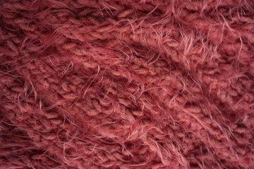 Fototapeta premium Pink long hair fur texture close-up, soft fluffy textile background