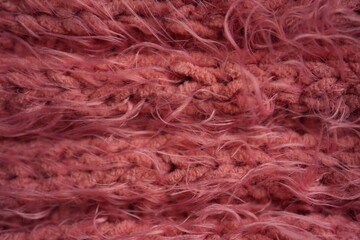 Obraz premium Pink long hair fur texture close-up, soft fluffy textile background