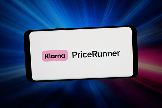 Stuttgart, Germany - 04-13-2026: In this photo illustration, the logo of price comparison company PriceRunner (Klarna) is displayed on a smartphone in front of abstract background on computer screen.