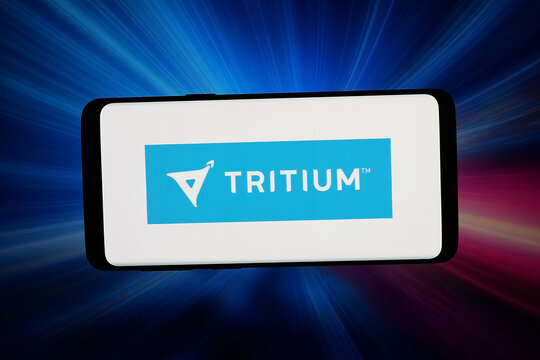 Stuttgart, Germany - 04-13-2026: In this photo illustration, the logo of US fast charging company Tritium is displayed on a smartphone in front of abstract background on computer screen.