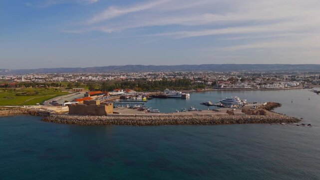 Low Aerial View Panning Away from Paphos Medieval Castle and Harbor Towards the Mediterranean Sea