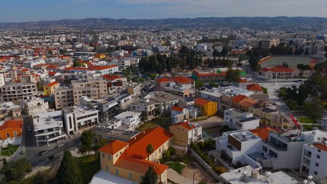 Wide Aerial Approach to Kennedy Square in Paphos with Distant Mountain Horizon Cyprus