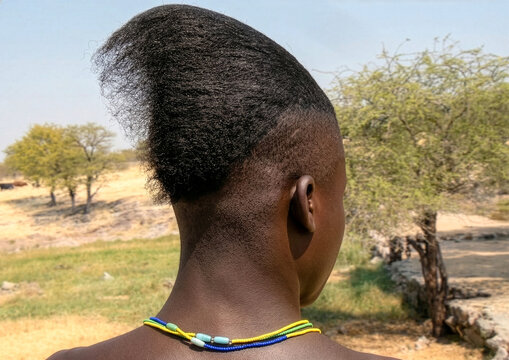 Himba tribe man with a special hairstyle which shows he is single, Cunene Province, Oncocua, Angola