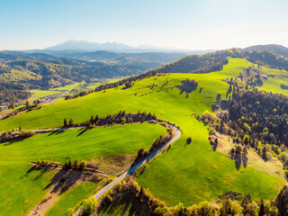 Mountain scenery with pastures and High Tatras mountains in the background. Pieniny mountains in Slovakia. View from Lesnicke sedlo © Zedspider
