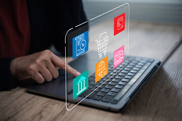 Obraz premium Businessman using laptop with ecommerce dashboard, online shopping cart, secure payment card, tax invoice, free shipping and digital banking icons. Concept smart retail and fintech sales.