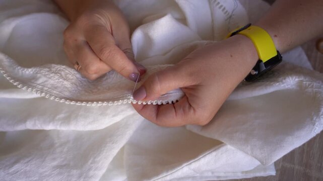 Traditional Ukrainian Embroidery. Learning embroidery techniques on a white fabric with detailed stitching patterns. Vyshyvanka