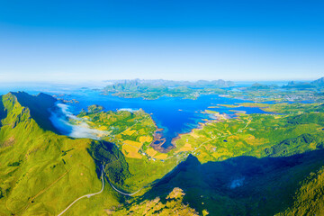 Aerial drone view of Leknes, Lofoten islands, Norway. Panoramic view from air. Scenic arctic landscape with high peaks, blue ocean and northern nature. © biletskiyevgeniy