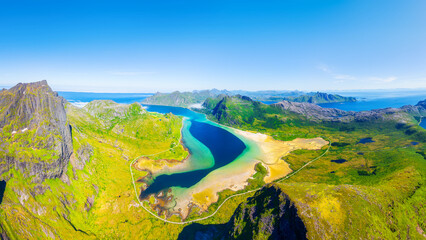 Aerial drone view of the fjords in Lofoten islands, Norway. Panoramic view from air. Scenic arctic landscape with high peaks, blue ocean and northern nature. © biletskiyevgeniy