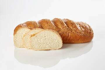 Fototapeta premium Sliced sesame bread loaf on white background