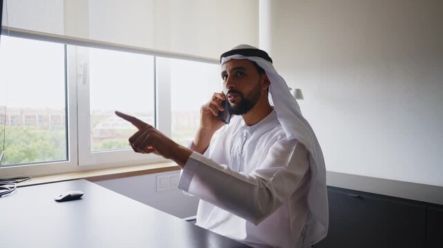 Men with dish dasha working in business office of Dubai. Portraits of successful businessmen in traditional emirates white dress. Concept about middle eastern cultures.
