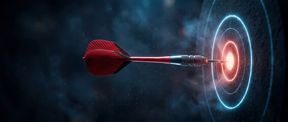Naklejka premium A dart hits the center of a glowing target with blue circles in a dark background