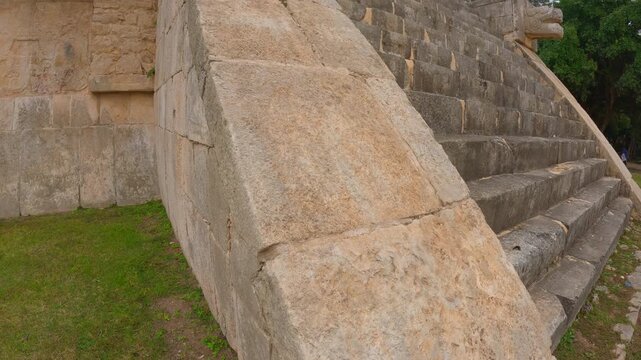 Ancient ruined Mayan building in the archaeological zone of Chichen Itza, Mexico. Historic stone structure surrounded by nature. Archaeology, cultural heritage and travel destination concept