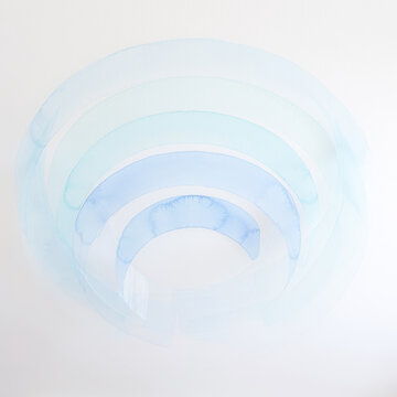 Stretch ceiling design, upward view with concentric translucent blue watercolor arcs, modern abstract ceiling mural, soft minimal interior decoration, calm airy composition