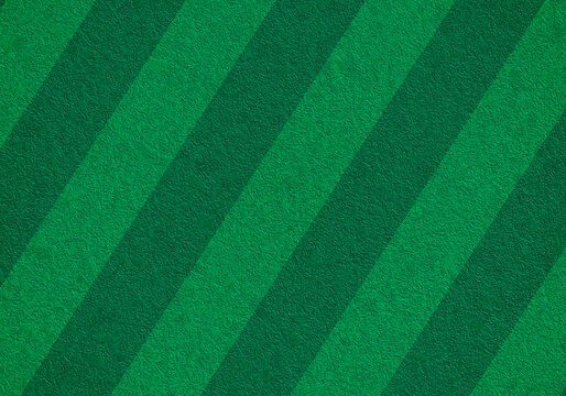 Fondo con patr&oacute;n de franjas diagonales en tonos verde oscuro y vibrante con textura de fieltro