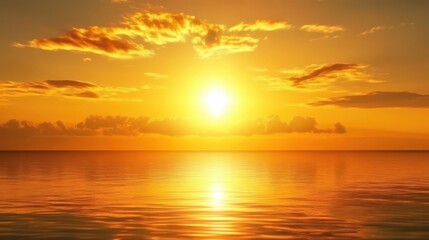 Obraz premium Brilliant Golden Sunset Over Calm Ocean Casting Warm Glow on Sky and Water