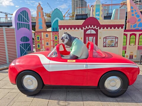 Shanghai,China-Oct.25th 2025: Flash the sloth from Zootopia driving a model red convertible car