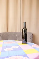 Fotobehang Eetkamer bottle of wine on table with tablecloth  © elenvd