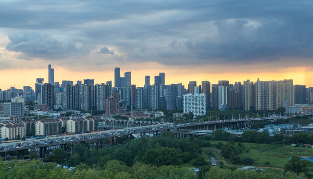 Nanjing skyline with elevated highway under storm clouds