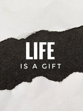 Inspirational torn paper design with bold text &ldquo;Life is a Gift,&rdquo; emphasizing motivation, positivity and appreciation of existence. Motivational quotes concept 