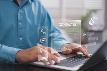 Fototapeta premium Customer support and omnichannel business communication concept. Professional using laptop for contact us form and AI chatbot interaction via digital interface for online help desk service.