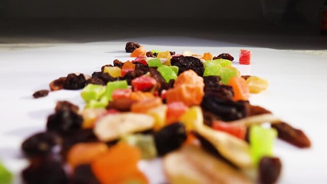 Colorful Mix of Candied Dried Fruits Scattered on a White Tabletop