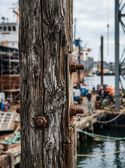 Fototapeta premium Weathered Wooden Beam with Metal Bolts