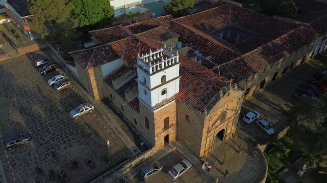Aerial view of the Santa Barbara church tower and surrounding colonial rooftops in El Socorro, Santander, Colombia