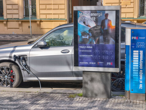 Prague, Czech Republic - April 22, 2026: Used BMW X5 charging at PRE POINT public electric vehicle station with cable connected in urban Prague.