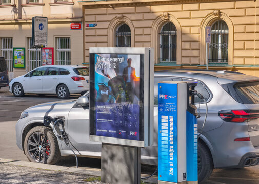Prague, Czech Republic - April 22, 2026: Used BMW X5 charging at PRE POINT public electric vehicle station with cable connected in urban Prague.