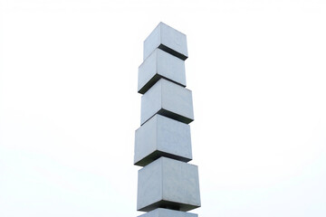 Fototapeta premium Tower of stacked concrete cubes against a bright sky