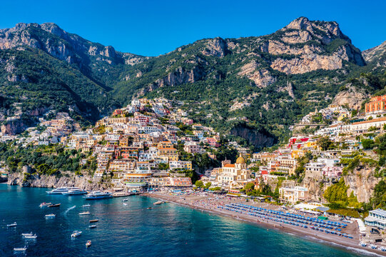 Aerial view of Positano with comfortable beach and blue sea on Amalfi Coast in Campania, Italy. Positano village on the Amalfi Coast, Salerno, Campania. Beautiful Positano, Amalfi Coast in Campania.