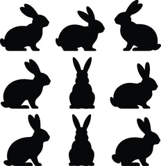 Fototapeta premium Collection of rabbit silhouettes in various poses, bunny icons set isolated on white background for animal, wildlife and design use