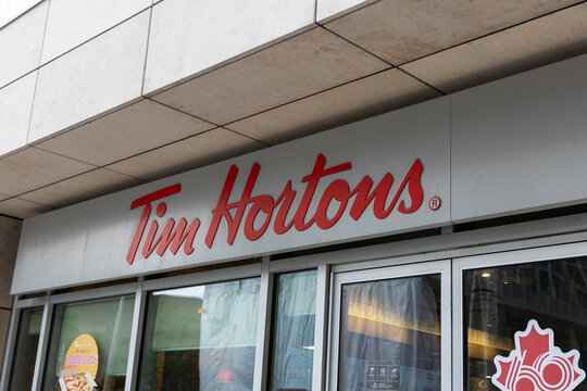 Ottawa, Canada - July 1, 2025: Tim Hortons logo above coffee shop storefront