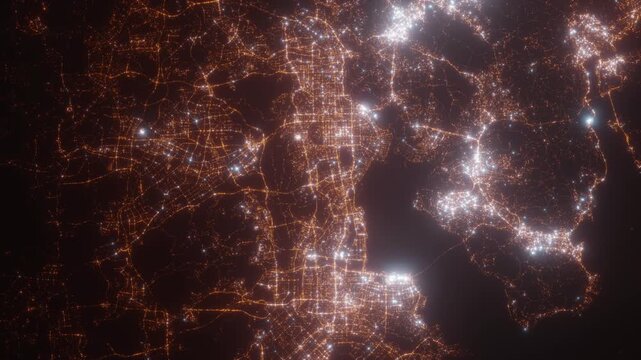 Shenzhen (China) top view at night. Aerial view on modern city with lights. Camera is flying above the city, moving backward. Vertical video. The north is on the left side