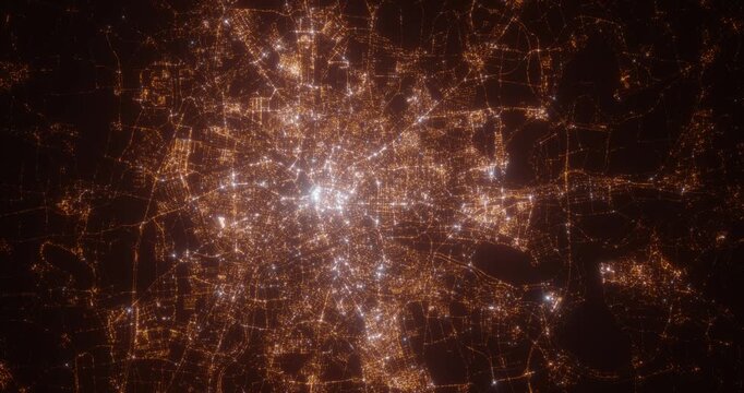 Leipzig (Germany) top view at night. Aerial view on modern city from space. Camera is flying above the city, moving forward. Vertical video. The north is on the left side