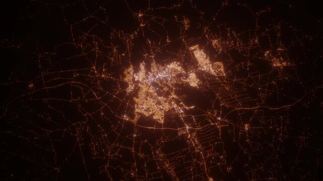 Meknes (Morocco) aerial view at night. View on modern city from space. Camera is zooming in, rotating counterclockwise