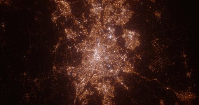 Glasgow (United Kingdom) top view at night. View on modern city from satellite. Camera is zooming in, rotating counterclockwise. Vertical video. The north is on the left side