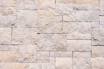 Fototapeta premium Beige stone wall background, texture