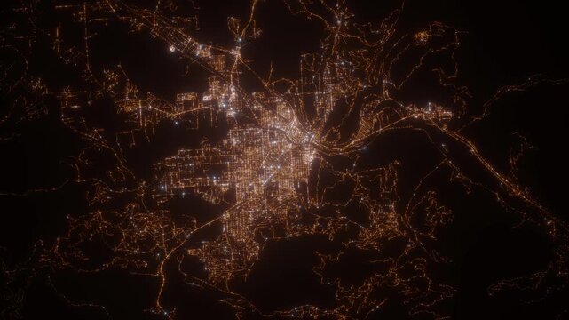Missoula (Montana, USA) aerial view at night. Top view on modern city with glow effect. Camera is zooming out, rotating counterclockwise