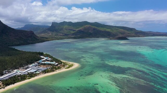 Aerial view of Le morne Brabant in Mauriutius. Tropical crystal ocean with Le Morne mountain and luxury beach in Mauritius. Le Morne beach with palm trees, white sand and luxury resorts, Mauritius.