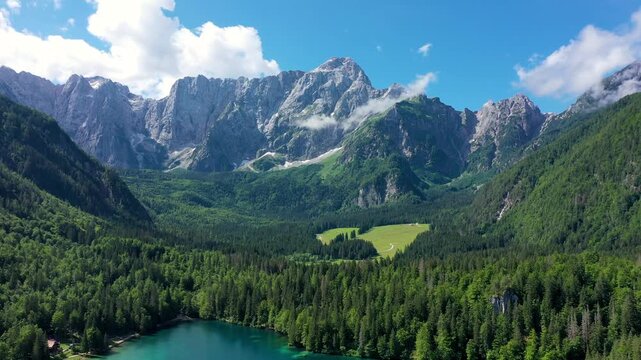 Lake of Fusine (Lago Superiore di Fusine) and the Mountain Range of Mount Mangart, Julian Alps, Tarvisio, Udine province, Friuli Venezia Giulia, Italy, Europe. Picturesque lake Lago Fusine in Italy.