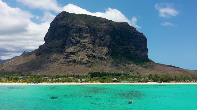 Aerial view of Le morne Brabant in Mauriutius. Tropical crystal ocean with Le Morne mountain and luxury beach in Mauritius. Le Morne beach with palm trees, white sand and luxury resorts, Mauritius.