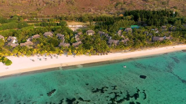 Tropical scenery, beautiful beaches of Mauritius island, Le Morne, popular luxury resort. Le Morne beach luxury resorts, Mauritius. Luxury beach in Mauritius, sandy beach with palms and blue ocean.