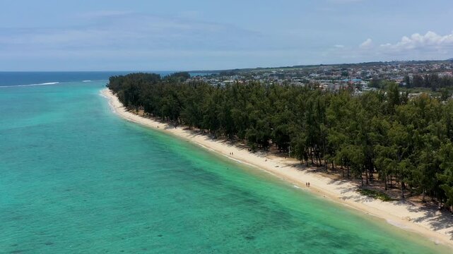 Beautiful Mauritius island with beach Flic en flac. Coral reef around tropical palm beach, Flic en Flac, Mauritius. Aerial view of a beautiful beach along the coast in Flic en Flac, Mauritius.