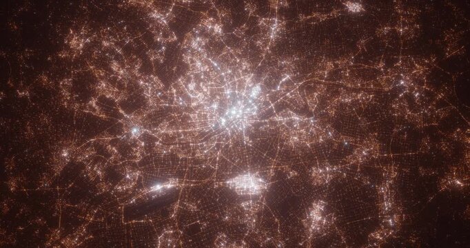 Frankfurt (Germany) aerial view at night. View on modern city from space. Camera is zooming in, rotating counterclockwise
