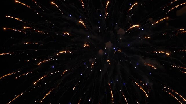 Bright explosion of firework in night sky, burst of sparks from pyrotechnic during a celebration event