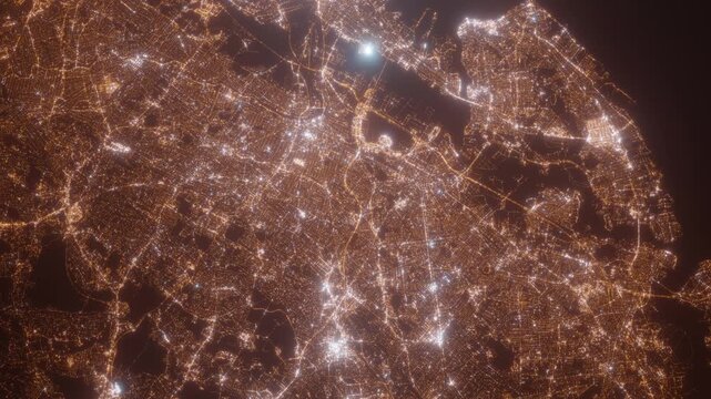 Newark (New Jersey, USA) aerial view at night. Top view on modern city with street lights. Camera is zooming out, rotating clockwise. Vertical video. The north is on the left side