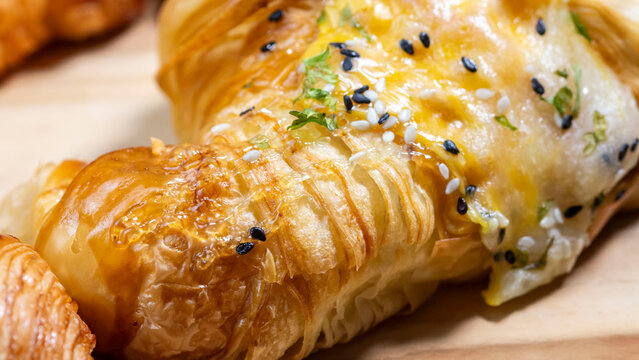 butter croisan with cream topping on plate