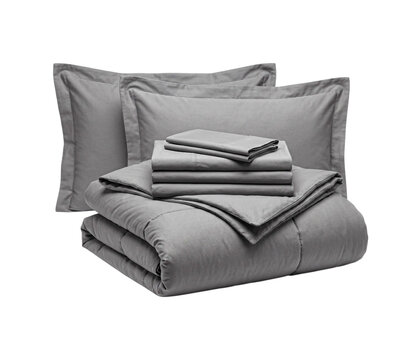 Stack of modern gray bedding set including pillows duvet and folded soft cotton sheets