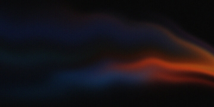 Vibrant gradient sky at dusk with dark clouds and orange glow